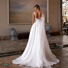Minimalist Backless A-Line Wedding Dress with Train - product photo