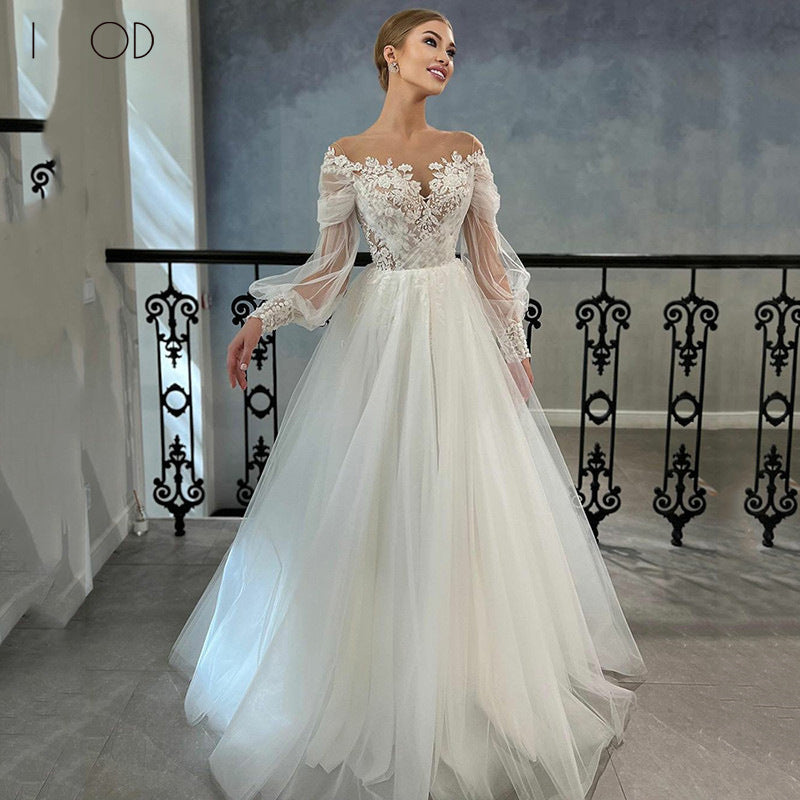 Off-the-Shoulder Lace Ball Gown Wedding Dress with Long Sleeves - product photo
